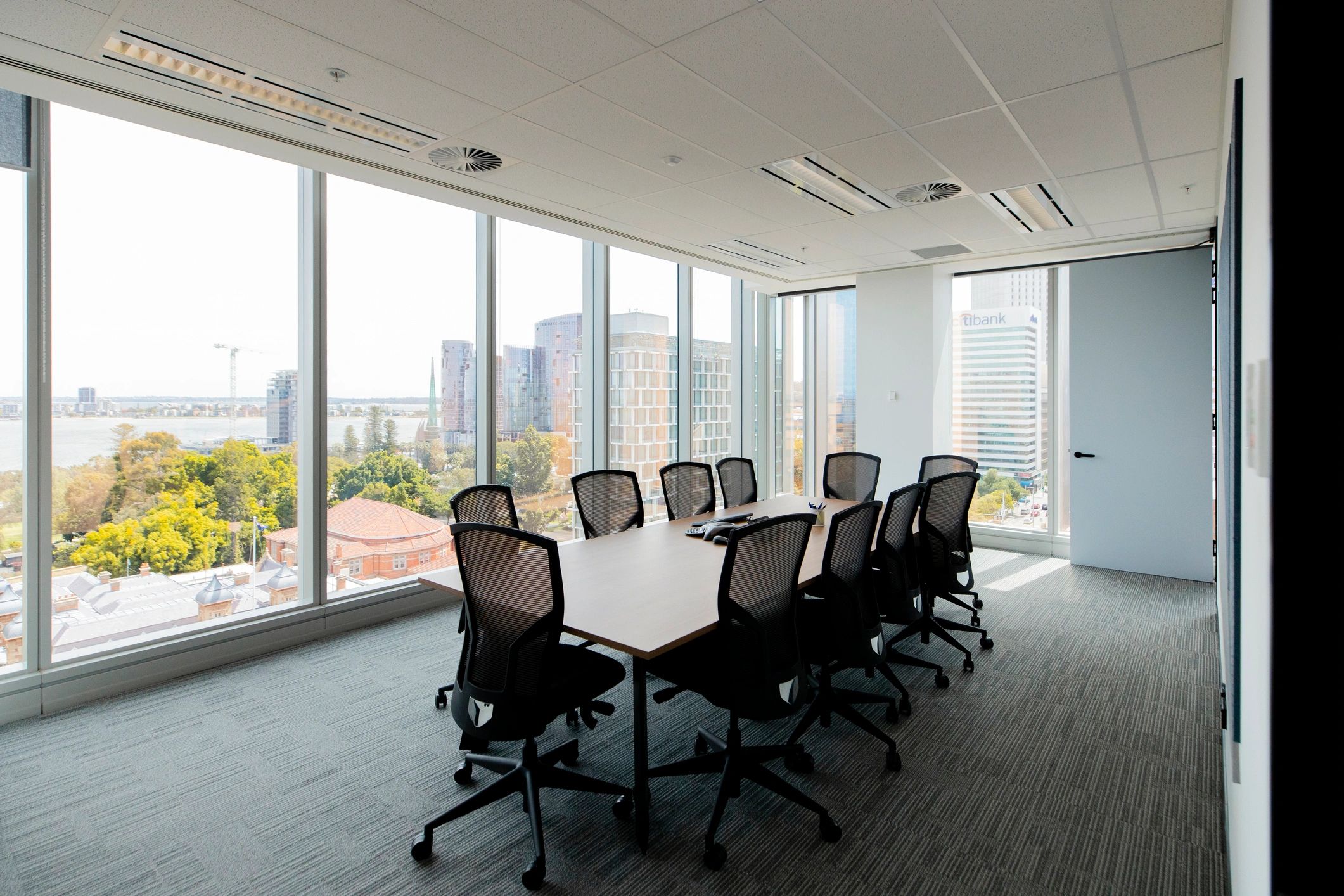 Boardroom set up for a meeting with city view