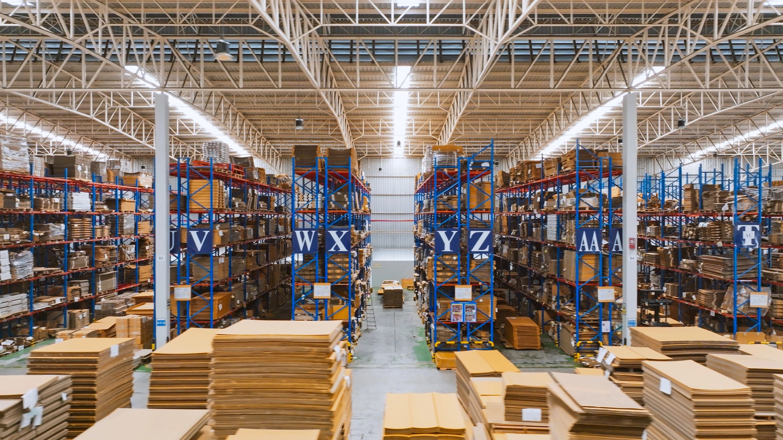 Warehouse shelving with packaged boxes ready for dispatch